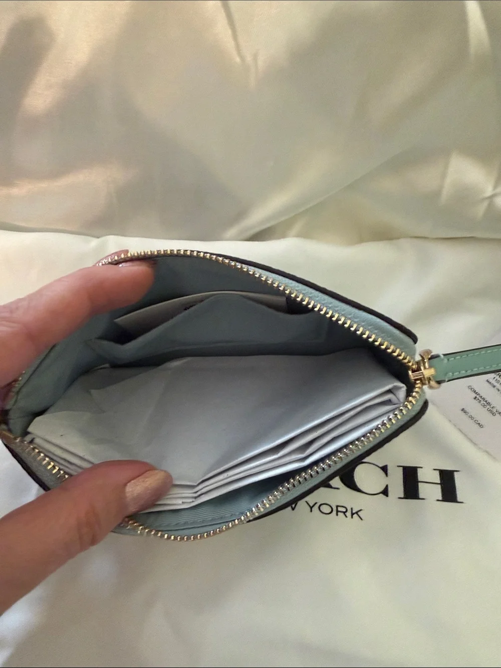 Coach wristlet featuring